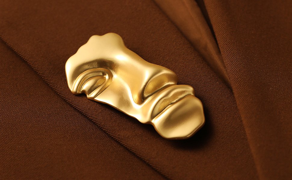 gold mask brooch